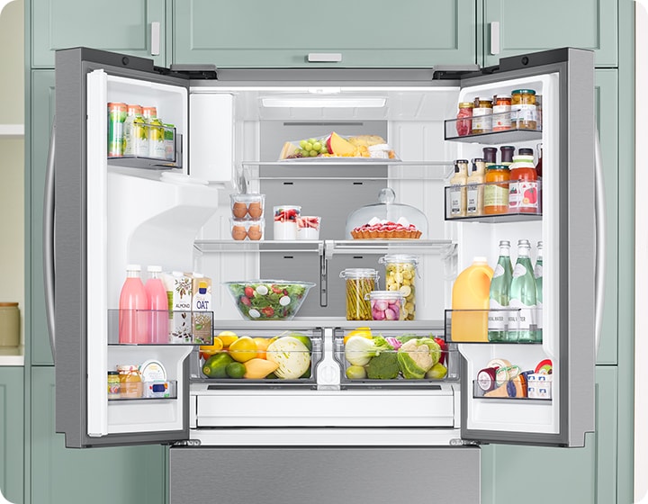 A refrigerator full of various foods is open. Cold air comes out through the vents in each compartment to maintain the optimal temperature for food to stay fresh.