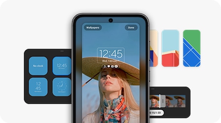 Un dispositivo Galaxy S23 FE visto frontalmente con la configuración de la pantalla de bloqueo modificada. Detrás se ve una selección de widgets y fondos de pantalla, además de un editor de video para crear reproducciones de este tipo en la pantalla de bloqueo.