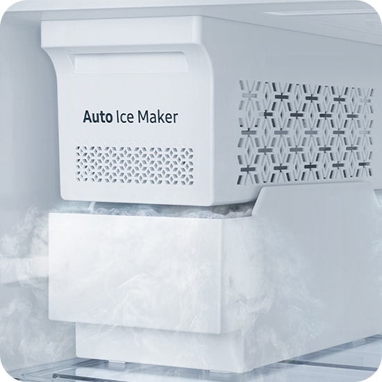 Close-up of the automatic ice machine. The ice cubes are full in the container below and the cold air flows.