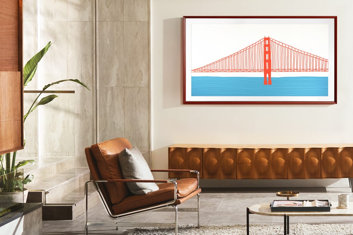 The Frame TV con marco Customizable Frame, en Beveled Style color ladrillo rojo, montado en la pared de una sala.