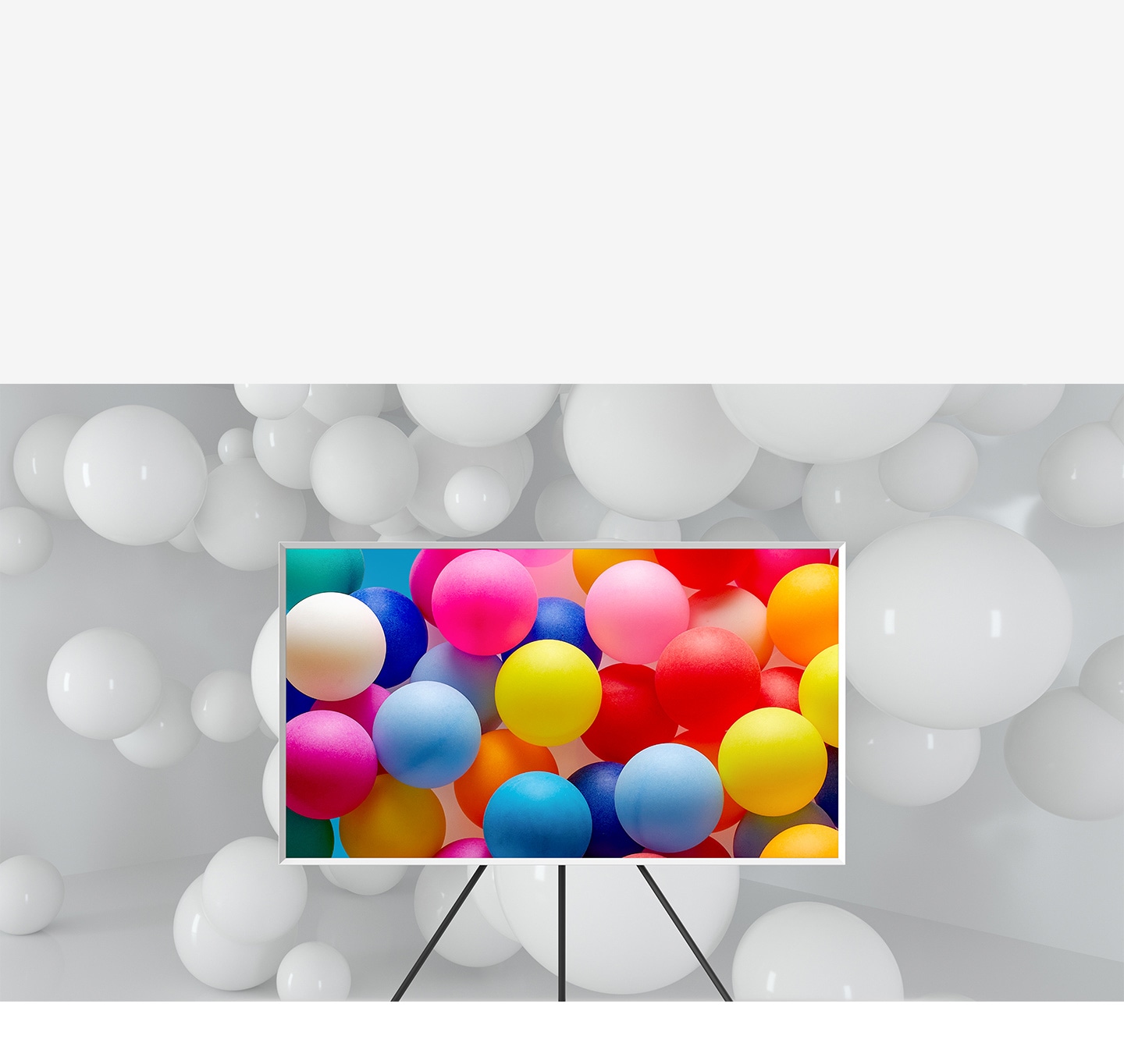 The Frame which is on Studio Stand is in a room full of white balloons. Only the balloons on the screen are visible in various vivid colours.