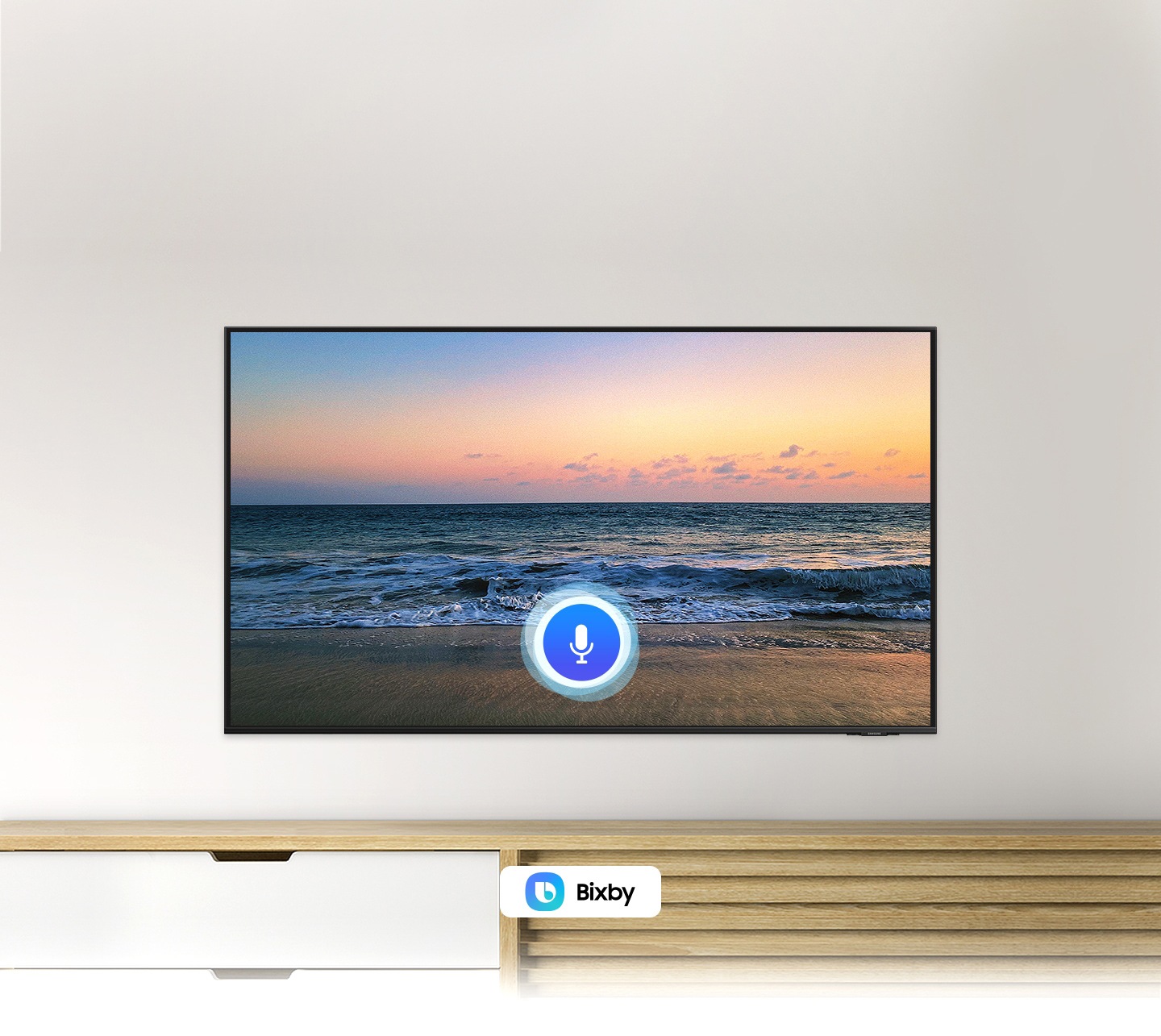 A microphone icon overlays a beach sunset TV screen image, demonstrating UHD TV voice assistant feature.