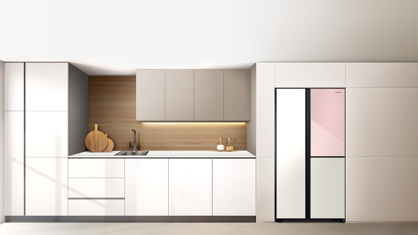 A 2-door refrigerator with a Clean White and Clean Pink is set in a stylish kitchen, placed flush with dark wood paneling.