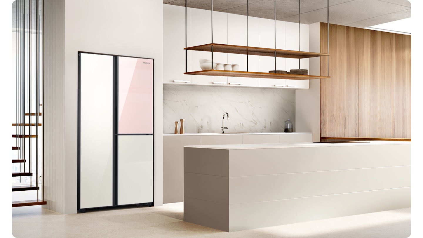 A 2-door fridge with a Clean White and Clean Pink is built into a stylish white and wood paneled kitchen.
