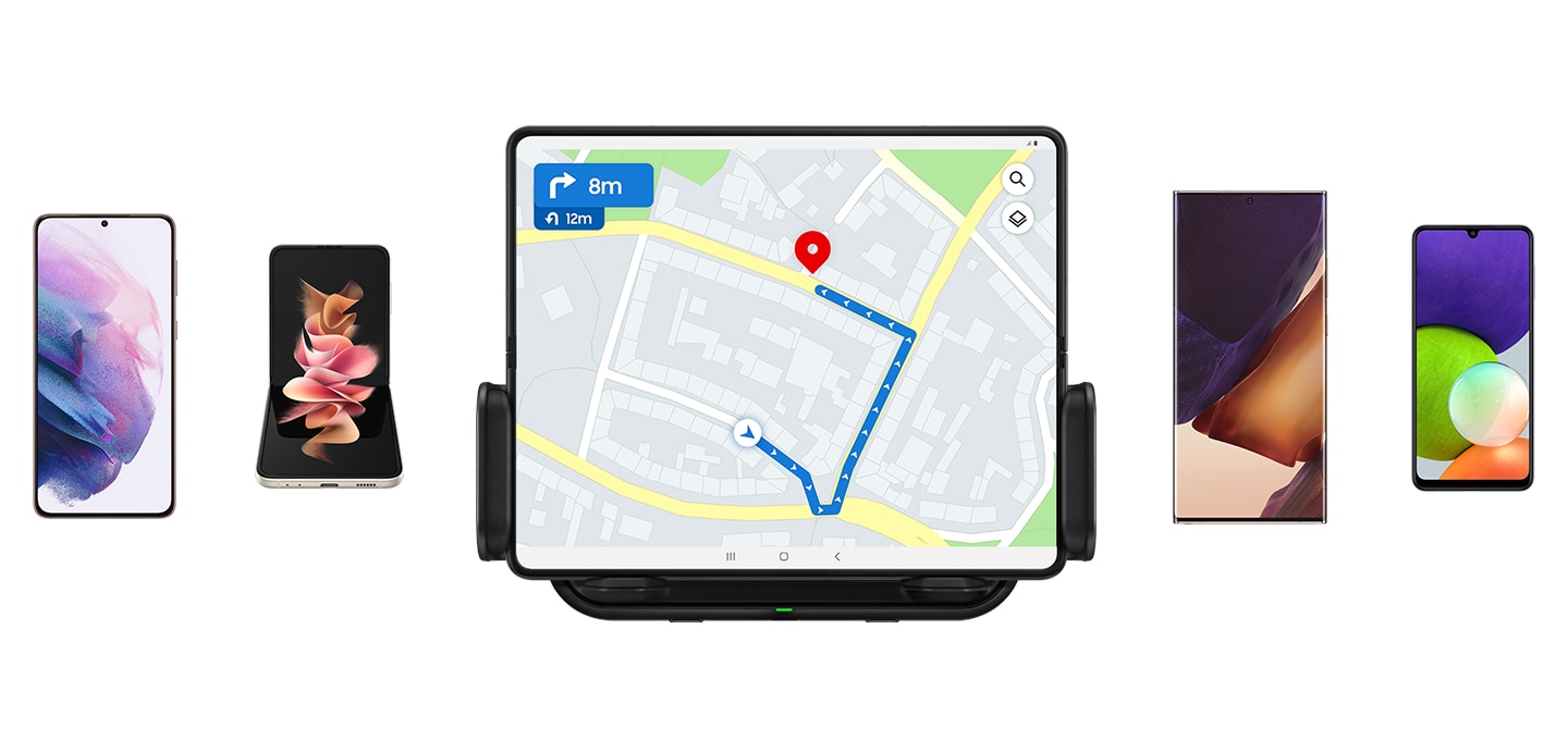 Five different types of mobile devices are facing forward. A Galaxy Fold with the navigation app opened is mounted to the wireless car charger.