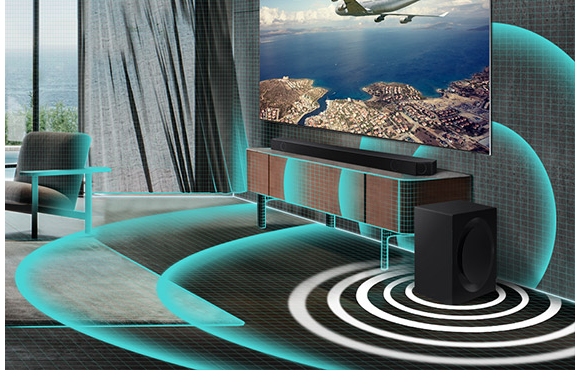 Closeup of soundbar and subwoofer in living room are shown. A grid graphic covers the living room and thickly drawn sound wave graphics are shown beneath the subwoofer to illustrate that Auto EQ is automatically filling the room with powerful bass.