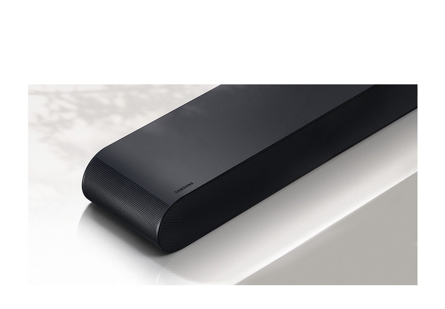 Closeup view of S60B soundbar which is shown in front with Samsung logo visible.