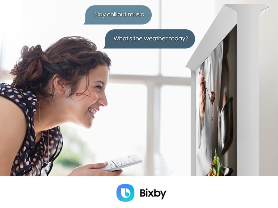 A woman is telling The Serif TV to Play chillout music and What's the weather today. OK Google, Alexa built-in and Bixby logos are shown.