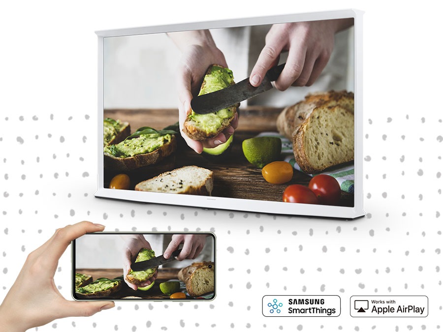 A person is mirroring their smartphone content on The Serif TV big screen.