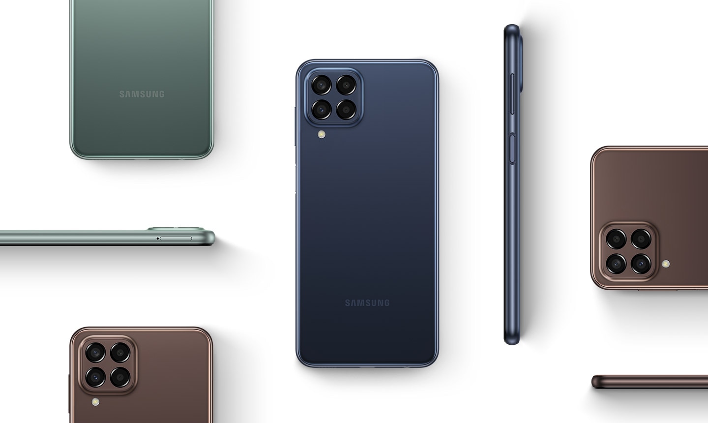 Various Galaxy M33 5G devices are placed in different positions to show the device from the back and the side. The devices are in Blue, Green and Brown colorways.