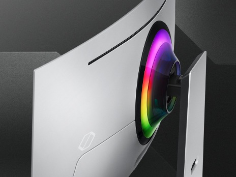 The backside of an Odyssey monitor is shown at an angle, revealing the glowing rainbow light surrounding its connection point.