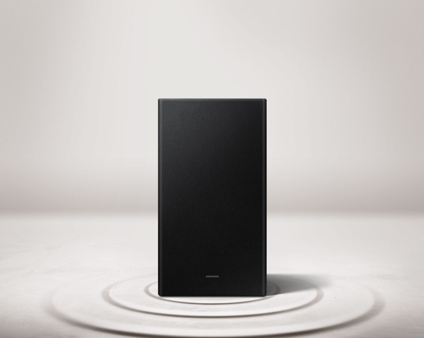 Vibration rings expand from a Samsung subwoofer on beat with the music to show the Soundbar's powerful bass.