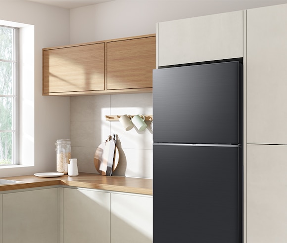 The sleek exterior of the fridge gives a clean look to the modern kitchen, with a flat finish.