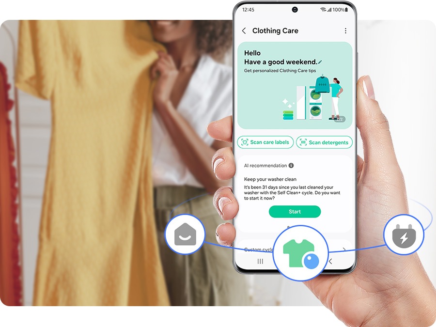 A hand holds a phone with the clothing care tab open from the SmartThings app on screen. There are scan care labels, scan detergents, and cleanse the washer options based on AI recommendation.