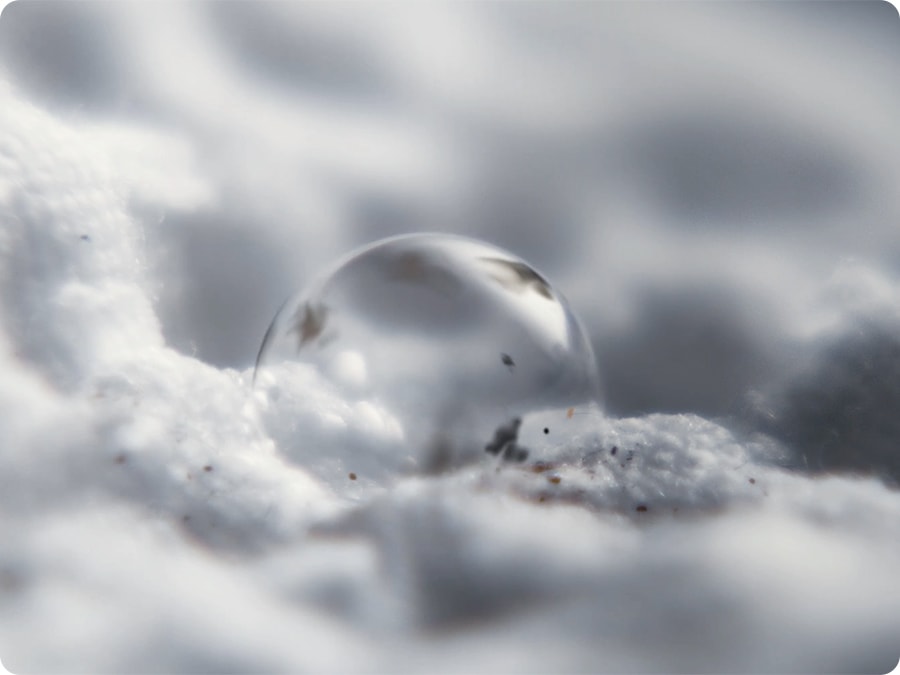 An ultra close-up of a bubble with dirt on the fabric of a piece of clothing, indicating AI Ecobubble's efficient wash.