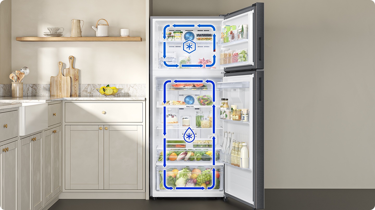 The door of the refrigerator is open. The arrows indicate that cold air is circulating in the top freezer and bottom fridge respectively.