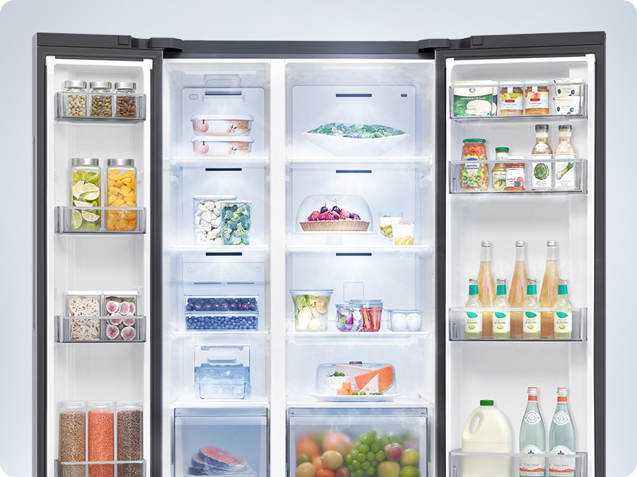 A refrigerator filled with various foods is open. Cool air comes out through vents in each compartment to maintain the optimum temperature for the food to stay fresh.