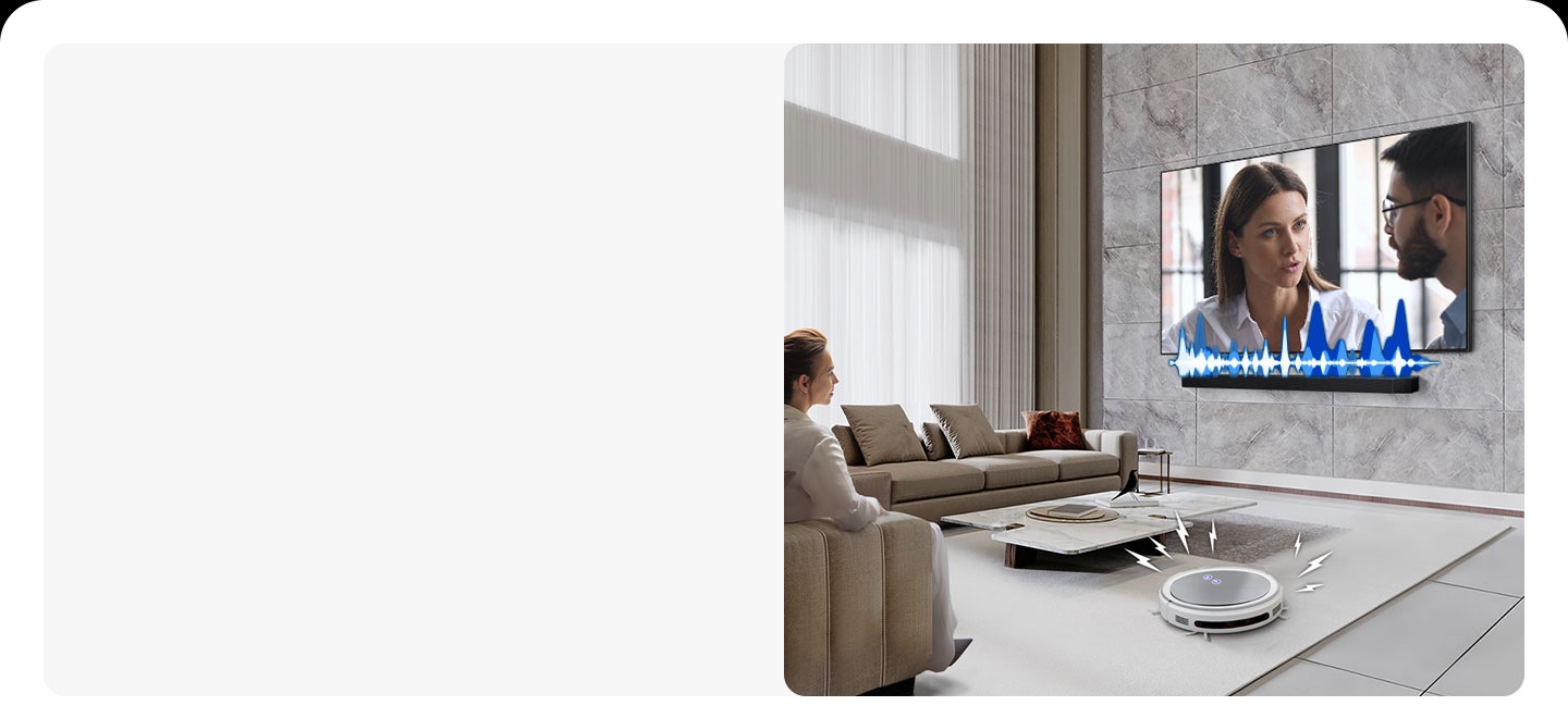 A woman is watching TV, which has a soundbar installed directly underneath. The soundbar has an audio bar indicating the level of volume. A robot vacuum cleaner rolls into the room, giving off distracting noise indicated by lighting bolts. In response, the soundbar plays at a louder volume, with the audio bar giving off greater activity.