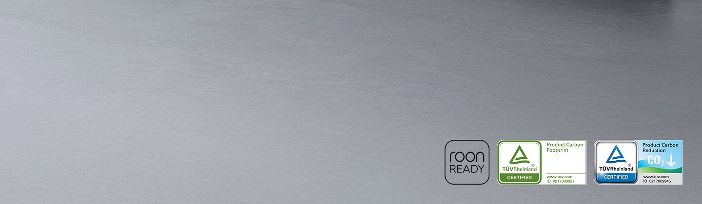 A soundbar, a subwoofer. Roon Ready logo. TUV Rheinland® Certified Product Carbon Footprint www.tuv.com ID 0217009957logo. TUV Rheinland® Certified Product Carbon Reduction CO2↓ www.tuv.com ID 0217009945 logo.