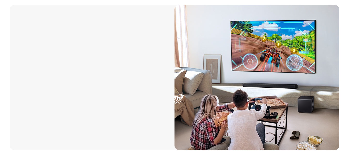Two people enjoy an immersive 3D-like gaming experience with Game Pro mode on their Samsung soundbar.
