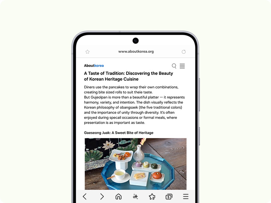 A smartphone screen displays an article from aboutkorea.org titled 'A Taste of Tradition: Discovering the Beauty of Korean Heritage Cuisine,' highlighting Gujeolpan and Gaseong Juak. The Galaxy AI button is tapped and a loading page with the text 'Crafting a quick read…' briefly appears, followed 