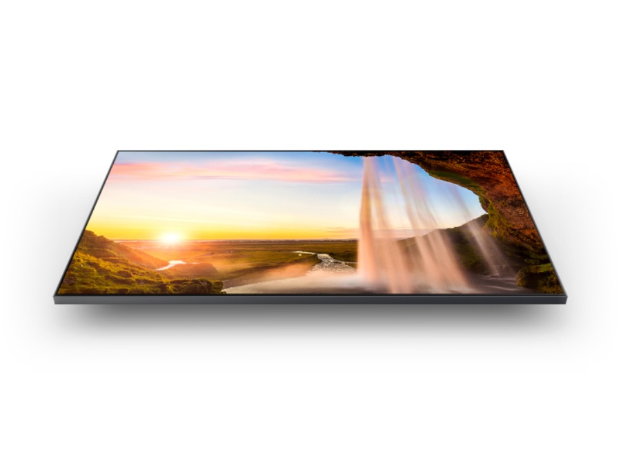 A QLED is displaying a sunset and a waterfall using the Dual LED backlight technology.