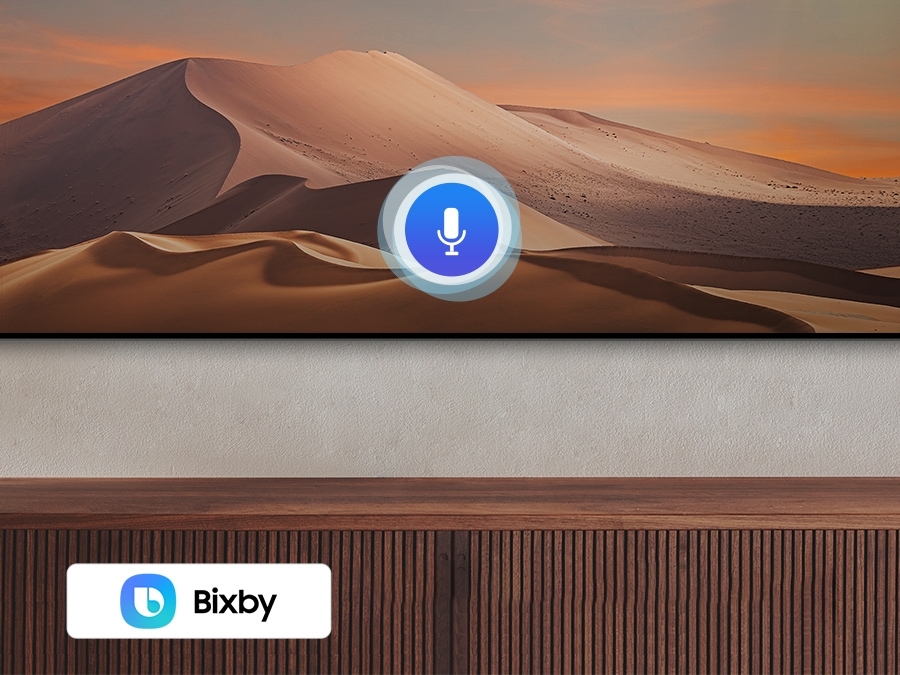 A microphone icon overlays an image, demonstrating voice assistant feature. The Bixby, Alexa built-in and the Hey Google logos are on display on the bottom.