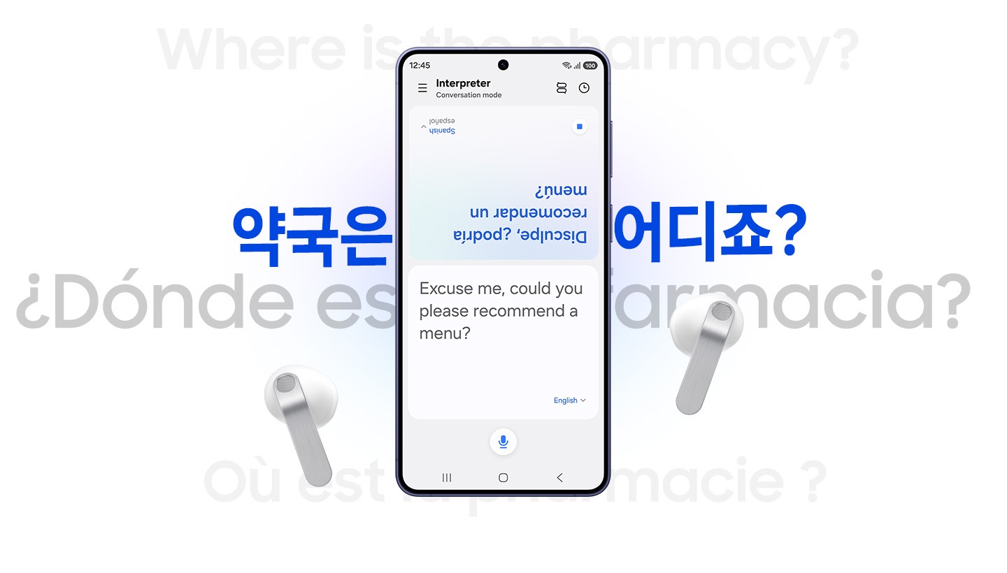 A Galaxy smartphone in between a pair of white, Galaxy Buds4. In the background is the phrase 'Where is the pharmacy?' in multiple languages. The smartphone shows the Interpreter screen open with the Spanish translation on the top half of the screen, and the English version on the bottom half of the screen.