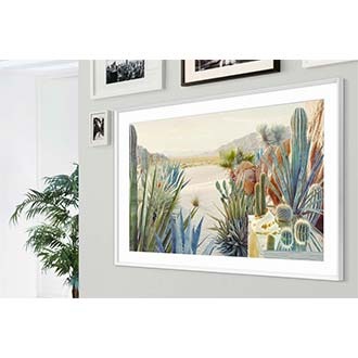 The Frame TV with its white Beveled Bezel is mounted on the wall.