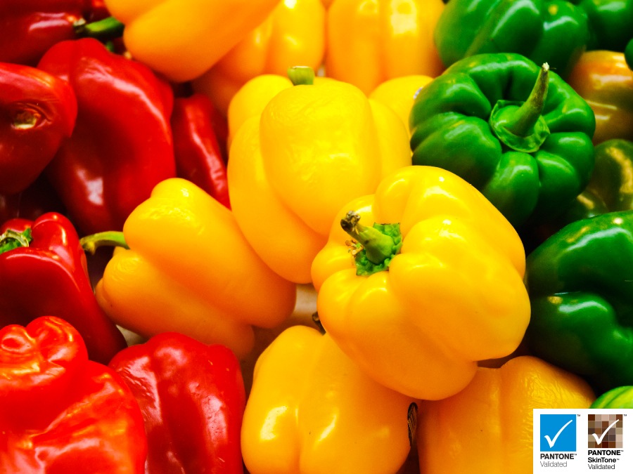 Yellow, Red, Green Paprikas Are Displayed. The Pantone Validated Logo and Pantone Skin Tone Validated Logo Are On Display