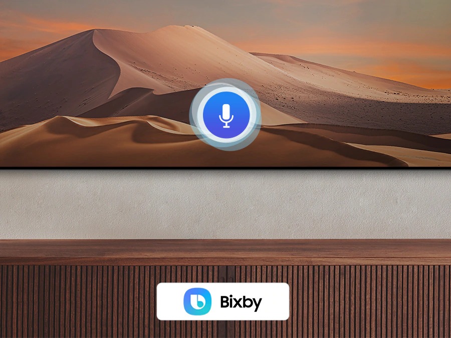 A microphone icon overlays an image, Demonstracting Voice Assistant Feature. The Bixby, Alexa Built-in and the Hey Google Logos Are On Display On The Bottom