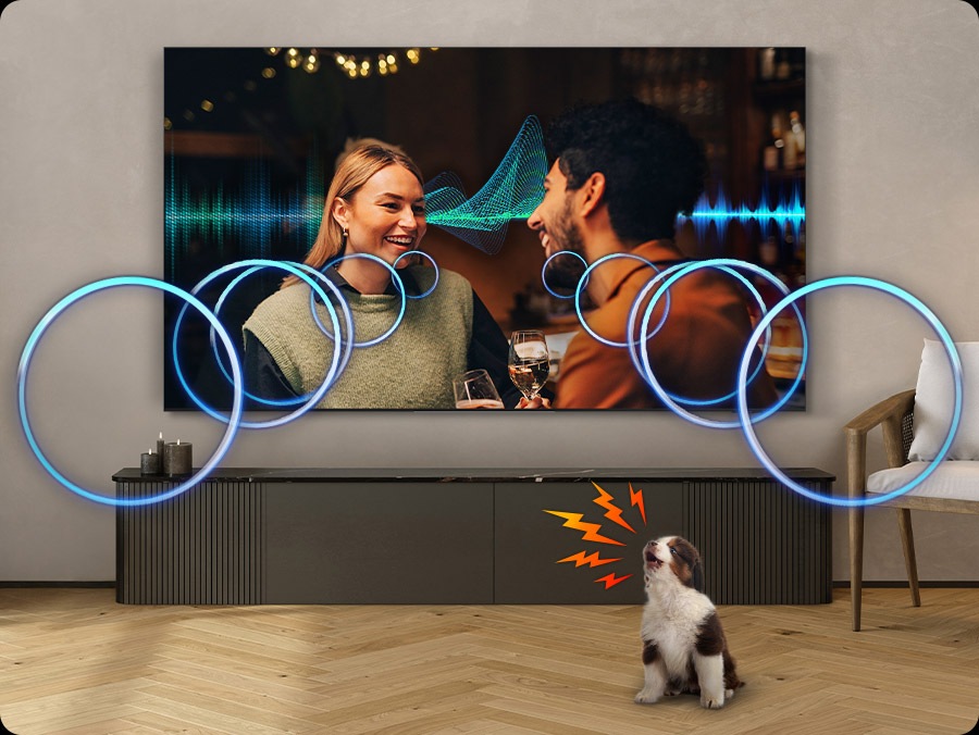 The volume of a TV dialogue increases to cover the sound of a puppy barking in a living room.