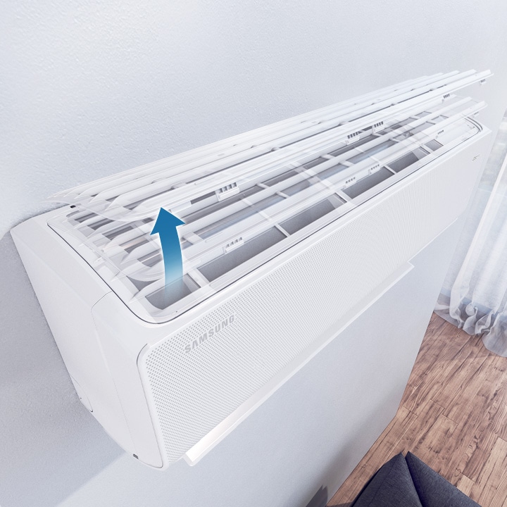 Shows that the Easy Filter Plus can be easily removed by lifting up the cover of the air conditioner, so that it can be cleaned.