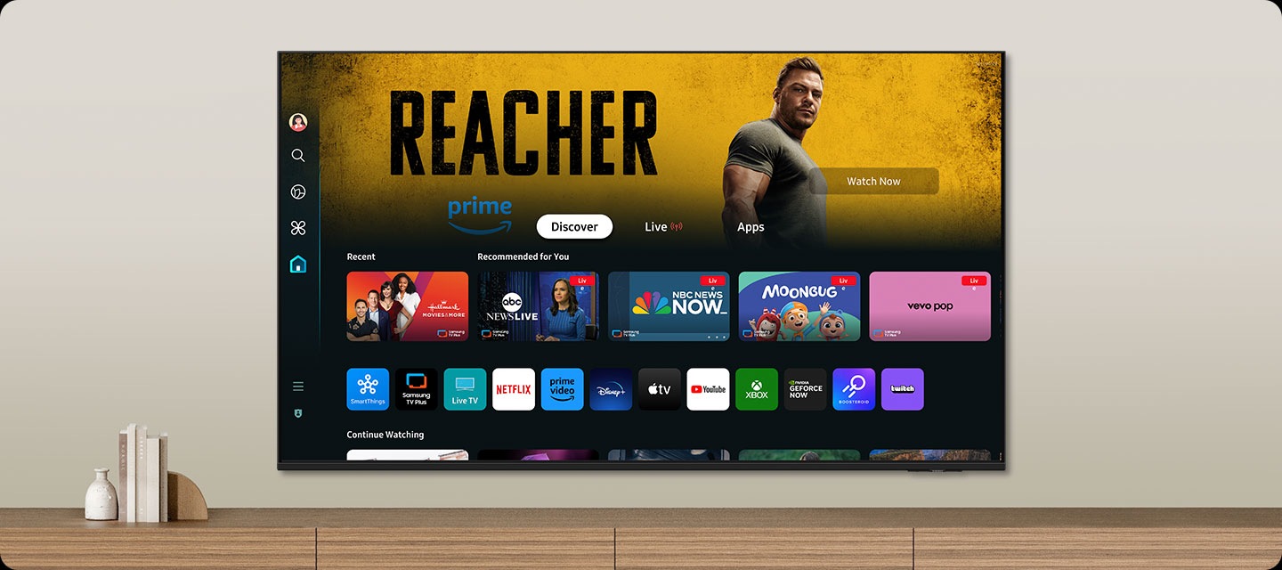 One UI Tizen’s home screen, with the various apps and services available, is displayed on a TV in a living room.
