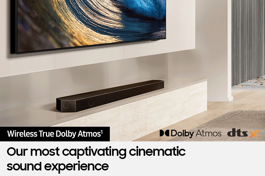 Samsung Soundbar connected wirelessly to TV. Dolby Atmos logo and DTS:X logo.