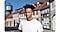 High quality portrait shot of a young man looking up, while the houses with many windows blurred out in the background.