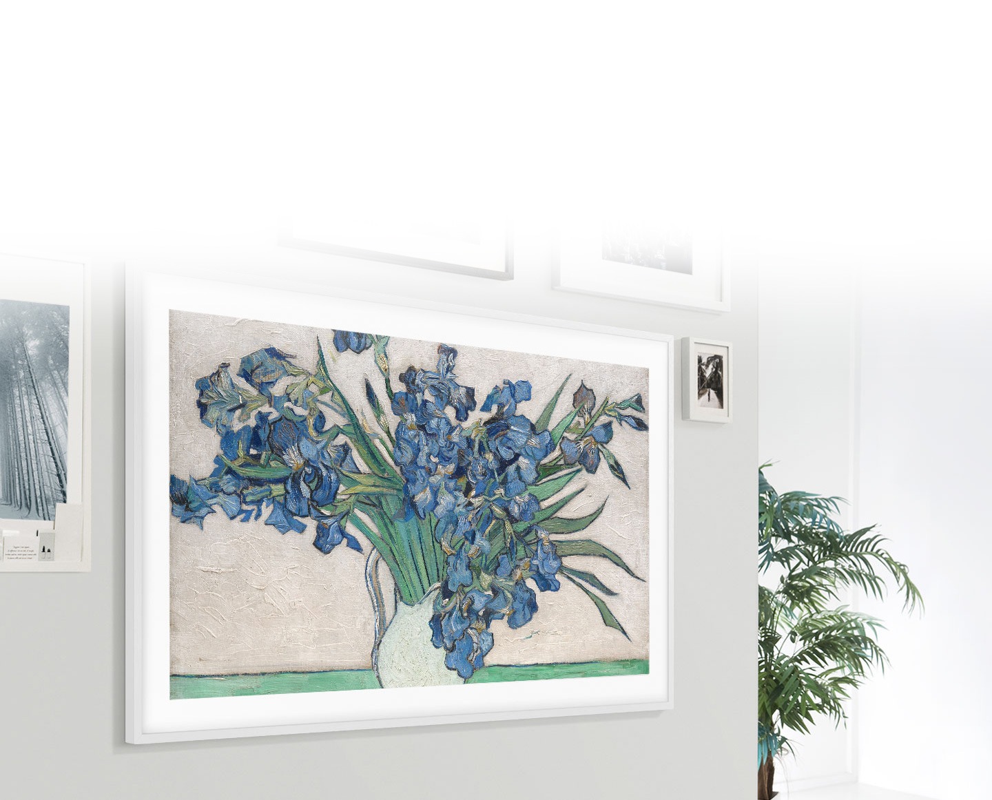 The Frame is hanging on the wall along with other picture frames, which makes The Frame look like a photo on the wall.