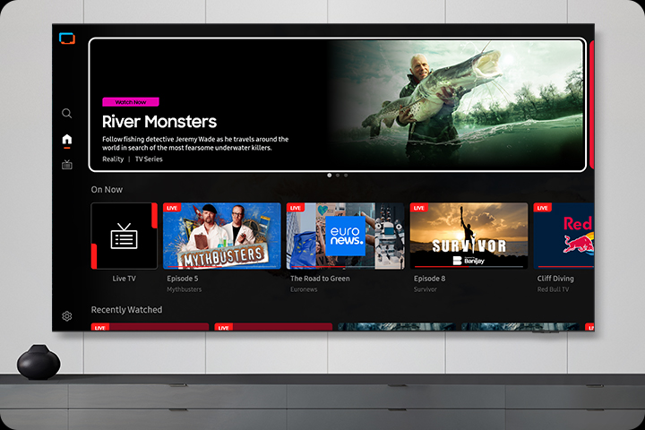 TV in a living room shows Samsung TV Plus home screen and the diverse TV channels available with it.