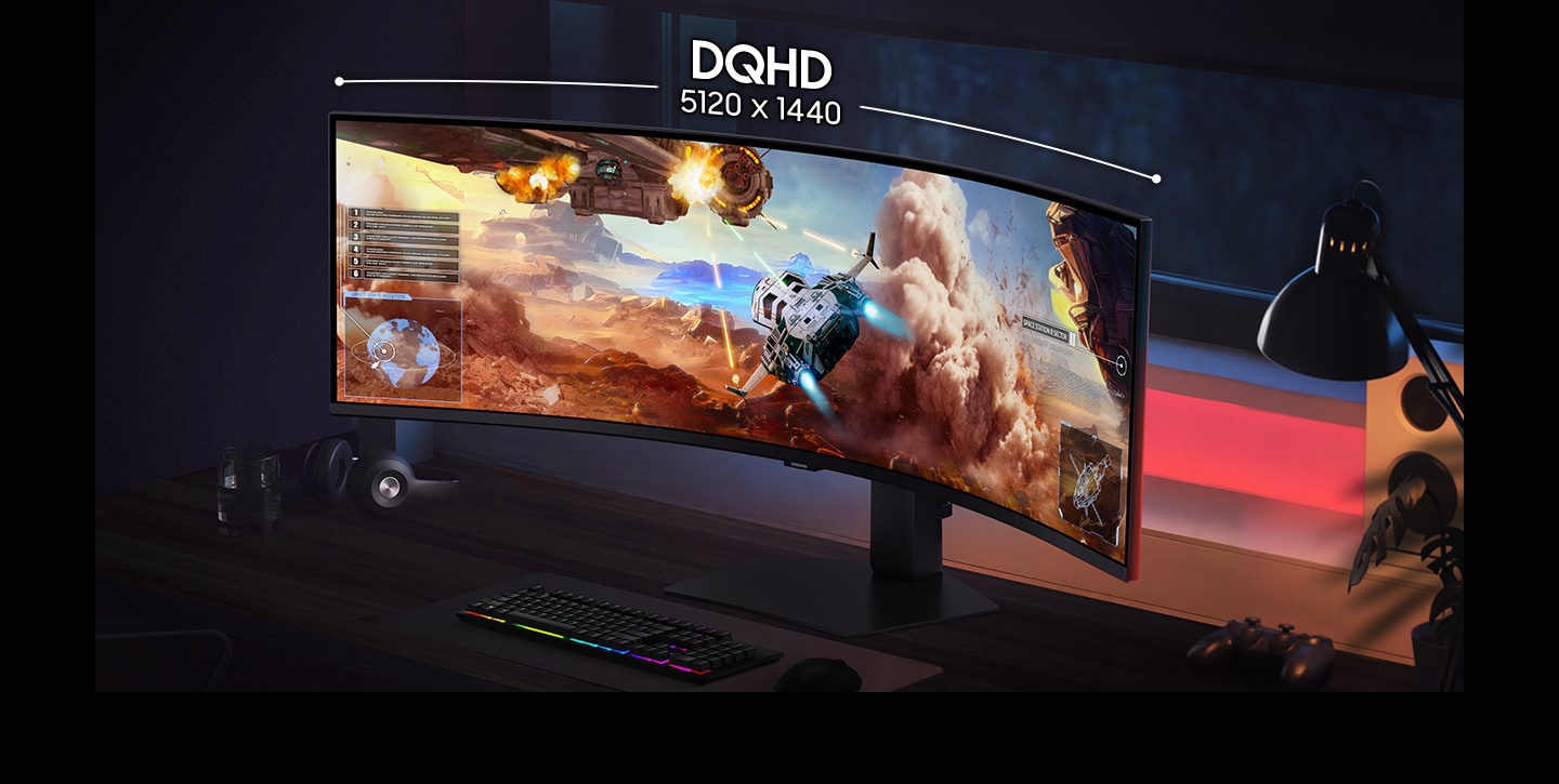 A gaming setup with DQHD 5120 x 1440 curved monitor. Screen shows wide view of small spacecraft shooting towards mothership.