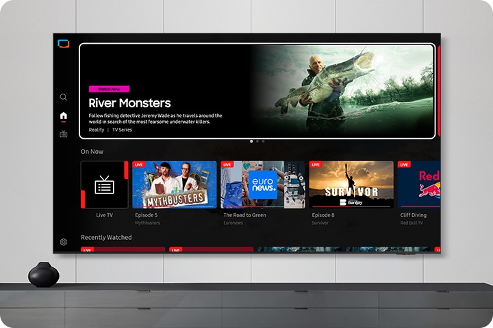 TV in a living room shows Samsung TV Plus home screen and the diverse TV channels available with it.