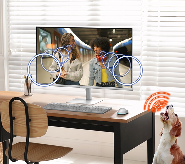 A modern monitor setup and a dog. Active Voice Amplifier enhances Dialogue sound when the dog barks.