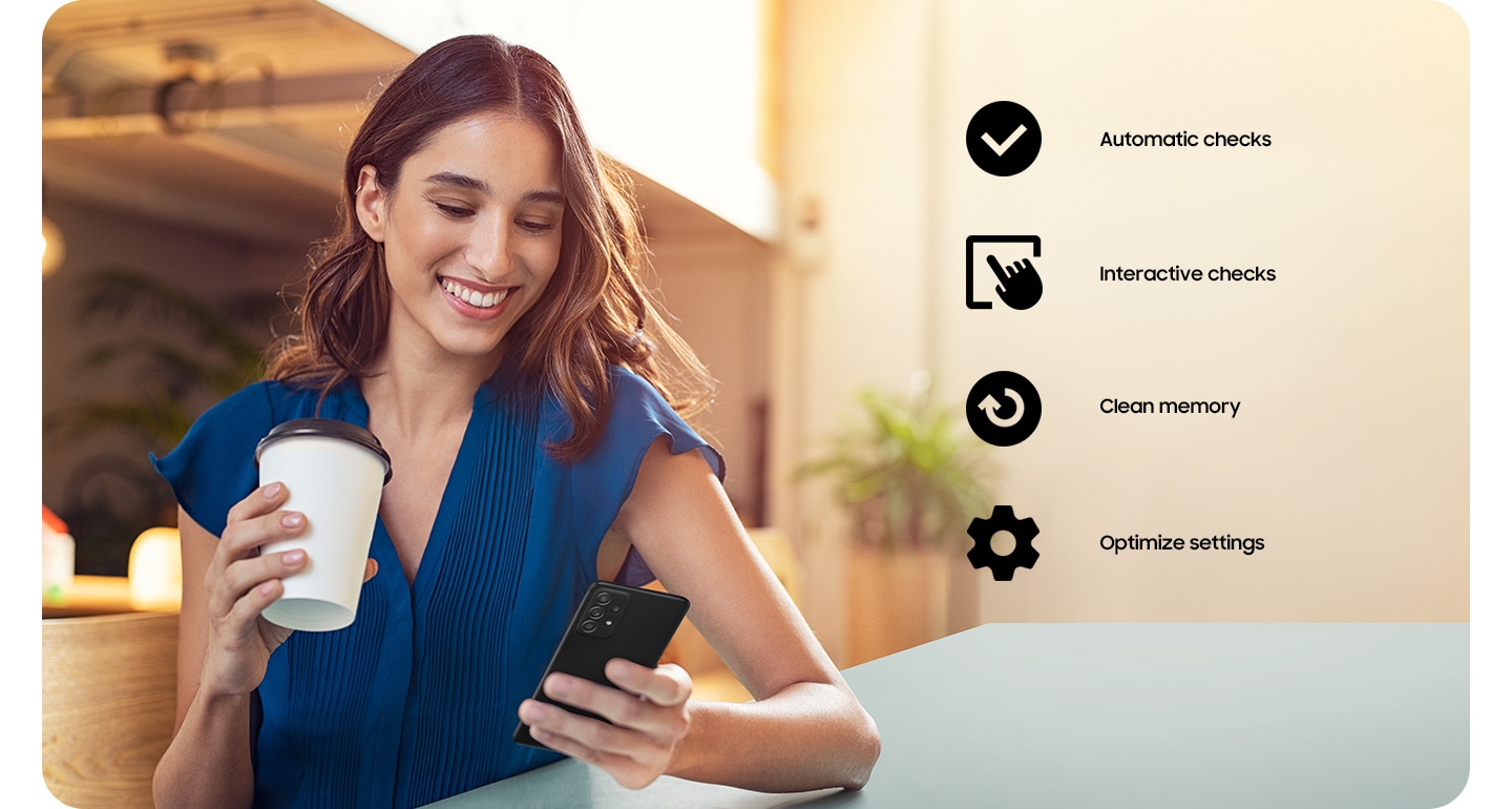 A woman holding a coffee cup and using her Galaxy A52. A checkmark icon for Automatic Checks, an icon of a hand tapping a screen for Interactive checks, an icon of arrow going in a circle for Clean memory and a cog icon for Optimize settings.