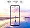 Galaxy A52 seen from the front. A scene of a man standing on a beach at sunset with pink and blue colors in the sky expands outside of the boundaries of the display. Text says Brightness 800 nits, Eye Comfort Shield, with the SGS logo and Real Smooth.