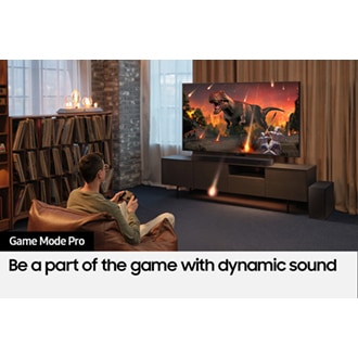A user enjoys an immersive gaming experience with Samsung Soundbar Game Mode Pro.