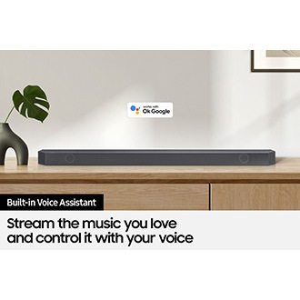 Ok Google logo can be seen along with Samsung Q800B soundbar which is sitting on living room cabinet.
