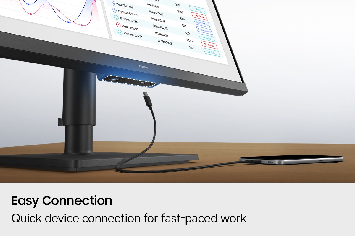 Easy Connection. Quick device connection for fast-paced work. A port at the bottom of the monitor is highlighted, and a phone charger is shown attempting to connect to it.
