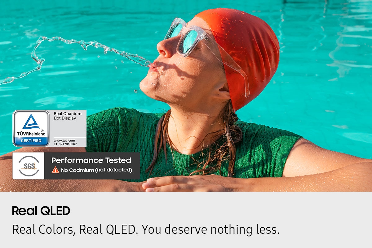 Scene of a woman in a pool spitting out water looks dull and washed out. TUV Rheinland Certified, Real Quantum Dot Display, www.tuv.com, ID 0217010367 logo. SGS Performance Tested No Cadmium (not detected) logo.