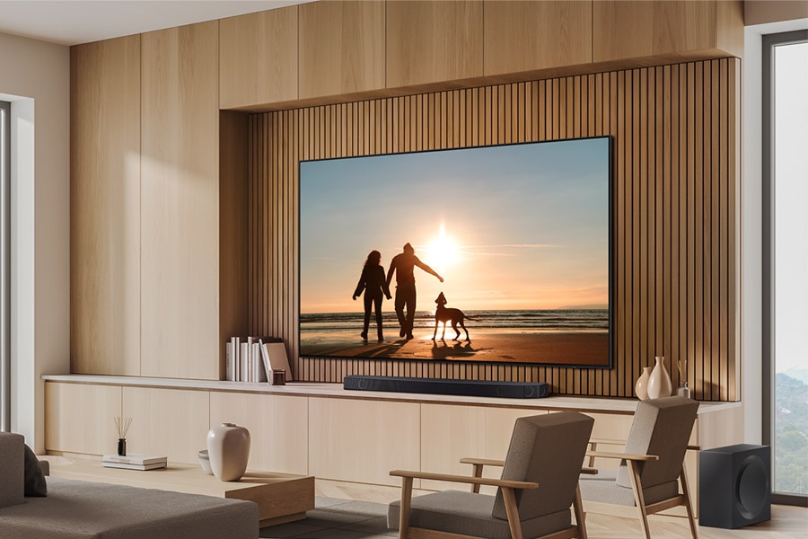 Wall-mounted QN87D and Soundbar in a wood-toned living room.