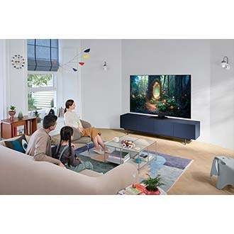 A family of 3 are watching a movie on the NEO QLED TV. 