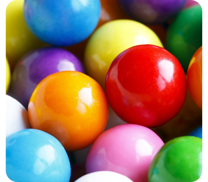 A close-up taken with the Macro Camera, showing the details of a group of small colorful spheres.